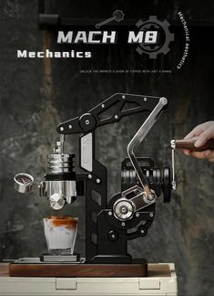 the machine is being used to make something in it's own cup and saucer