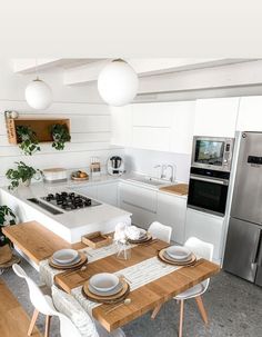 the kitchen is clean and ready to be used for dinner or other entertaining purposes in someone's home