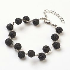 "BRACELET Length: 7 7/8\" Main Stone: Natural Black Lava Beads 8 mm Extended: 50 mm Material: Natural Lava Beads, Brass Findings NECKLACE Length: 20.47'' Main Stone: Natural Black Lava Beads 14-15 mm Extended: 50 mm Material: Natural Lava Beads, Brass Findings, 1mm waxed cotton cord Lava beads are lightweight and comfortable to wear and they bring a natural and easy way to enjoy the benefits of aroma of your favorite essential oil all day long. In addition, Lava Stone is a wonderful aromatherapy Nickel Free Black Beaded Bracelets For Crafting, Black Beads Lava Stone Bracelet As Gift, Black Rosary Bracelet With 8mm Beads For Jewelry Making, Casual Lava Stone Jewelry Gift, Silver Beaded Bracelets With 8mm Lava Stone Beads, Lava Stone Bracelets With Black Beads For Gift, Black Beaded Bracelets With Lobster Clasp For Gift, Casual Black Beaded Lava Stone Bracelets, Casual Lava Stone Jewelry With 8mm Beads