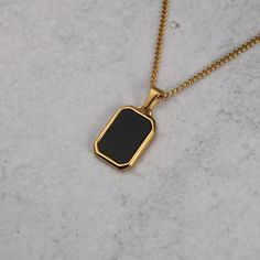 Gold Onyx Pendant Chain Necklace FREE & Fast Shipping! *Premium Stainless Steel *18K Gold Plated *Pendant Length is 22 Millimeters *Polished Onyx Gemstone *Available with 20 Inch or 22 Inch Length Micro Chain *We Recommend 1mm or 2mm Width Chains to Fit Pendant *Will not tarnish, fade, or discolor *Safe in Water *Pendant is removable *Also available in Silver **Check out the rest of our Pendants Collection here --> https://www.etsy.com/shop/famedgoodsnyc?section_id=35454751 Shipping Time -Allow Black Pendant Chain Necklace, Tarnish Resistant, Black Tarnish Resistant Pendant Chain Necklace, Black Tarnish Resistant Pendant Necklace, Black Tarnish-resistant Pendant Chain Necklace, Black Rectangular Chain Necklace, Black Rectangular Chain Necklace With Adjustable Chain, Mens Gold Pendant, Onyx Pendant, Onyx Gemstone