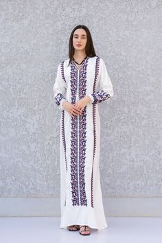 This stunning kaftan with its colorful embroidery will be your summer favorite. It is an extremely comfortable wear, light and soft and can be used on many occasions -  home gatherings, festival parties, summer occasions, dinners, or just in your home to feel comfortable.  Fabric : 70% Egyptian Cotton and 30% Polyester Sizes : The dress comes in two sizes. S/M/L which fits up to a size 14 US (Large) and one that fits up to a size 22 US (2XL). It comes with a cinch in the back to accentuate your Eid Embroidered Maxi Dress In Multicolor, Floral Embroidered Floor-length Kaftan For Eid, Multicolor Embroidered Maxi Dress, Eid Multicolor Embroidered Maxi Dress, Eid Multicolor Resham Embroidered Kaftan, Traditional Maxi Length Kaftan With Chikankari Embroidery, Traditional Maxi Kaftan With Chikankari Embroidery, Bohemian Floor-length Abaya With Floral Embroidery, Spring Floor-length Kaftan With Resham Embroidery