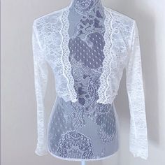 Chantelle Eternelle Lace Bolero. Open Front, Long Sleeves, Cropped Fit, Sheer Lace Construction, Scalloped Lace Trim, Approximately 15 Inch Length, And Imported. Runs True To Size. Gorgeous, Romantic French Allure Was Feature In Their Lingerie Line. However, Would Look Beautiful Over A Summer Dress. Lace Bolero, Pink Sports Bra, Scalloped Lace, Lace Bra, Sheer Lace, Front Open, Purple And Black, Travel Size Products, New Black