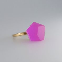 This ring has been carefully handcrafted in our workshop.  it has been designed to comply with our modular concept,  an idea that allows building and customising your own jewellery pieces.  this ring consists of two modules: top: vu crystals 12mm magenta pink acrylic resin crystal + ring band: minimal ring sterling silver  the top and the ring band are already assembled and the ring is ready to dazzle.  to swap your ring top you simply need to unscrew it by hand and replace with an alternative m Minimalist Pink Rings For Gift, Modern Pink Promise Ring, Minimalist Pink Open Ring Jewelry, Minimalist Pink Wedding Rings, Modern Pink Ruby Ring For Gift, Modern Pink Ruby Ring As A Gift, Modern Pink Rings For Wedding, Unique Pink Open Ring, Pink Open Ring