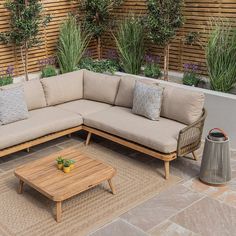 a couch and coffee table on a patio