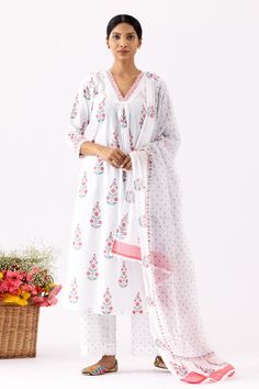 Ivory A-Line kurta with all over purple floral block print, crochet lace work details and V neck. Paired with pant with polka dot print and mulmul dupatta with crochet lace border.
Components: 3
Pattern: Printed and Embellished
Type Of Work: Floral, Polka Dot Block Print and Crochet Lace Work
Neckline: V Neck
Sleeve Type: Three Quarter Sleeves
Fabric: Cotton Cambric, Dupatta: Mulmul
Color: Ivory
Other Details: 
Cut work hem
Front gathered details
Printed dupatta
Side slits
Occasion: Puja,Work - Pink Amaryllis, Floral Block Print, Kurta Set For Women, Printed Dupatta, A Line Kurta, Kurta With Pants, Lace Border, Kurta Set, Suit Set