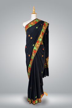 Formal Kashmiri Saree In Black, Pure Crepe Saree Regal Chinar, Hand Aari Embroidered Saree Immerse yourself in the rich heritage of Kashmiri craftsmanship with this exquisite Chinar Pure Crepe Saree adorned with intricate hand aari embroidery. The luxurious black crepe fabric serves as a canvas for the exceptional artistry of the skilled artisans of Kashmir, who dedicate countless hours to create the breathtakingly beautiful motifs adorning this saree. The centerpiece of this saree is the heavy Festive Black Embroidered Pre-draped Saree, Black Silk Saree With Resham Embroidery, Black Silk Pre-draped Saree With Resham Embroidery, Black Tussar Silk Traditional Wear With Resham Embroidery, Festive Traditional Wear In Paithani Silk With Embroidered Border, Festive Paithani Silk Traditional Wear With Embroidered Border, Festive Traditional Paithani Silk Wear With Embroidered Border, Black Cutdana Traditional Wear For Ceremonial Occasions, Ceremonial Black Traditional Wear With Cutdana