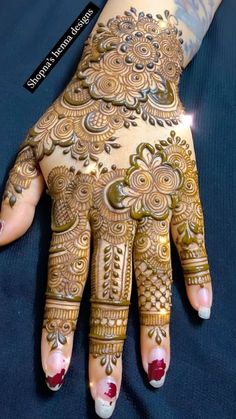 henna tattoo on the palm of someone's hand