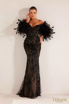 Step into the spotlight with the 241E2479 Asymmetrical Embroidered Off-Shoulder Trumpet Column Evening Dress. This gown is a harmonious blend of sophistication and allure, designed to make you the center of attention. Featuring a seductive off-shoulder neckline, a figure-hugging bodycon silhouette, and intricate embroidery on luxurious Point D’esprit fabric, this dress exudes timeless elegance. With color options in Black and Nude, you can opt for classic allure or understated chic. The addition of long sleeves offers a hint of modesty without compromising on allure. Elevate your evening with this extraordinary dress and make an unforgettable entrance. Nude Evening Dresses, Feather Dresses, Terani Dresses, Navy Evening Dresses, Sweetheart Neck Dresses, Designer Formal Dresses, Off Shoulder Evening Dress, Bodycon Evening Dress, Modern Princess