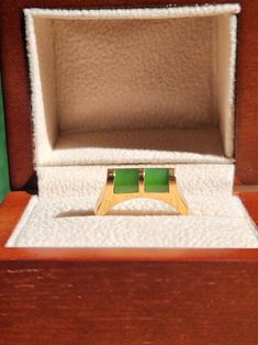 Canadian Jade 70's Vintage Collection: A Grade British Columbia NephriteThis Jade ring is stunningly crafted, featuring beautiful Canadian Nephrite Jade set into gold-plated. Available in multiple sizes while supplies last The box is not included but comes in a velvet gift bag. Vintage Jewelry is all Final Sale Rectangular Emerald Ring With Polished Gold Finish, Rectangular Gold Emerald Ring, Gold Rectangular Emerald Ring For May Birthstone, Vintage Rectangular Emerald Ring Gift, Collectible Gold Emerald Ring With Gemstone, Collectible Gold Emerald Gemstone Ring, Gold Emerald Ring Collectible, Gold Plated Green Rings For Gift, Modernist Gemstone Signet Ring As Gift