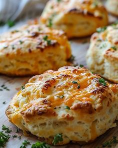 biscuits with cheese and parsley on a cutting board