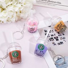 starbucks keychains are sitting on a table