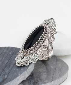 Black Onyx Solid 925 Sterling Silver Filigree Oval Elongated Statement Ring Material: 925 Solid Sterling Silver, 925 Stamped Ring Face Length: 1.60 inches   Width: 0.70 inches Genuine Natural Black Onyx Stone: 8 mm x 22 mm, Oval, Cabochon 10 Carat Natural Gemstone Nickel free Comes with a free gift pouch and box Free Domestic Shipping Excellent quality, have sold in the USA, Canada, Italy, Germany and the UK, and received hundreds five-star reviews.  Our fine silver jewelry is made in our exclus Onyx Silver Ring, Hematite Jewelry, Designer Silver Jewellery, Fine Silver Jewelry, Black Onyx Stone, Sterling Silver Filigree, Silver Filigree, Black Stone, Engraved Rings