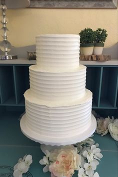 a large white cake sitting on top of a table