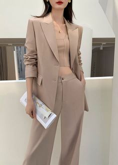 Elevate your style with our Gillian One Button Blazer Wide Leg Pantsuit Set. Crafted in luxurious khaki fabric and featuring a single-breasted blazer and wide leg pants, this set exudes sophistication and elegance. Perfect for any occasion, it's a must-have for those who demand the finest in fashion. Notched lapels Long sleeve Single-breasted closure Wide leg pants Polyester,Spandex Item #241175 Women's blazer & wide-leg pants set SIZE INFO XS=US2=UK6=EU32 S=US4-6=UK8-10=EU34-36 M=US8-10=UK12-14 Blazer And Wide Leg Pants, One Button Blazer, Breasted Blazer, Blazer Buttons, Height And Weight, In Fashion, Single Breasted, Leg Pants, Polyester Spandex