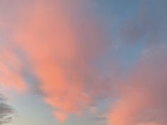 the sky is pink and blue with some clouds