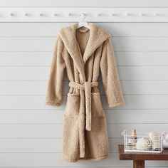 Get cozy after a warm bath or shower with this super-soft Sherpa robe. Full of style and comfort, this solid layer will make you feel like you're having an instant spa day. Plus, it's made entirely from recycled materials. KEY PRODUCT POINTS OEKO-TEX(R) STANDARD 100: tested for 1000+ harmful substances to keep you and your family safe from chemicals common to textile manufacturing. 14.HUS.42449 HOHENSTEIN HTTI. Made of 100% recycled polyester. Designed with a plush hood, 2 roomy pockets, sash be Cozy Super Soft Winter Robe, Cozy Solid Super Soft Sleepwear, Cozy Solid Color Super Soft Sleepwear, Cozy Winter Robe Super Soft, Cozy Winter Robe, Super Soft, Cozy Super Soft Robe For Loungewear, Cozy Super Soft Long-sleeved Robe, Super Soft Cozy Robe With Long Sleeves, Super Soft Long Sleeve Robe For Loungewear