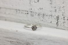 Someone once said that flowers are God's sweetest creations without a soul, and we couldn't agree more and the rose is the most beloved flower of all time. Roses symbolize love and happiness. This dainty rose ring is the perfect way to express your love, friendship or admiration for your beloved! Crafted from sold sterling silver. This ring is beautiful on its own or looks lovely stacked with my sterling silver vine ring linked below. ✥ Sterling Silver ✥ Available in sizes 3-10 ✥ Beautifully box Delicate Rose Colored Rings For Gift, Delicate Rose Color Rings For Gifts, Dainty Rose Design Flower Ring For Anniversary, Elegant Flower Ring With Roses For Gift, Dainty Rose Design Flower Ring For Gift, Dainty Rose Colored Rings As Gift, Dainty Rose Design Flower Ring Gift, Dainty Rose Design Flower Promise Ring, Delicate Rose Design Flower Ring As Gift