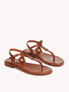 Chloé Marcie Sandal | Chloé US Elegant T-strap Sandals With Flat Heel For Vacation, Luxury Sandals With Leather Footbed And Ankle Strap, Luxury Ankle Strap Sandals With Leather Footbed, Elegant Flat T-strap Sandals With Heel Strap, Elegant Beach T-strap Sandals With Adjustable Strap, Classic Calf Leather Flat Sandals, Classic Flat Calf Leather Sandals, Spring Calf Leather Sandals With Tang Buckle, Elegant Leather Footbed Sandals With Buckle Closure