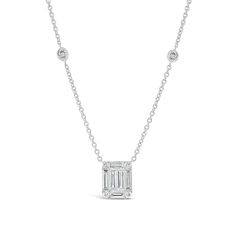 Classic, simple, and chic — this rectangular pendant features round-cut and baguette diamonds set to appear as one glittering emerald cut solitaire. Bezel-set diamonds on its cable chain enhance the piece’s elegant sparkle.- 18K gold weighing 5.55 grams - 12 round diamonds totaling 0.34 carats - 6 straight baguettes totaling 0.93 carats Available in yellow, white, and rose gold. Please allow 4-6 weeks for delivery if item is not in stock. Item no. N09451 Diamond Necklace With Rectangular Pendant, Rectangular Diamond Cut Diamond Necklace, Classic Jewelry With Baguette Diamonds In Rectangular Shape, Rectangular Pendant With Baguette Diamonds, Baguette Cut Solitaire Diamond Necklace, Baguette Cut Diamond Solitaire Necklace, White Gold Emerald Cut Baguette Diamond Necklaces, Anniversary Diamond Necklace With Rectangular Pendant, Rectangular Diamond Cut Necklace