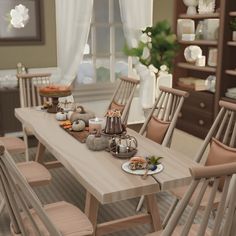 a wooden table topped with lots of plates and chairs next to a shelf filled with food