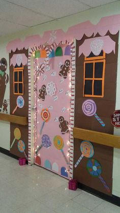 two doors decorated with candy and candies on the side of a school hallway wall