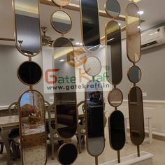 an assortment of mirrors hanging on the wall