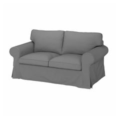 a gray couch with two pillows on it