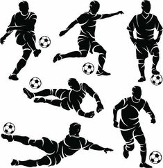 silhouettes of soccer players kicking the ball