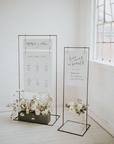 two metal frames with flowers in them on the floor