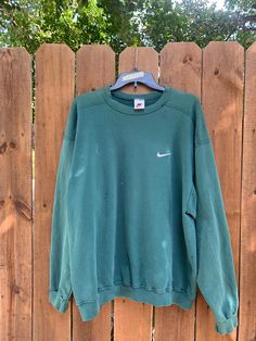 Distressed vintage sweatshirt in good shape. Does have some flaws, please view photos for details. Measurements: Pit to pit 24 inches  Neck to hem 28 inches  Message me if you have any questions. SKU-bn412 Returns are accepted with a 20% of restock fee. Buyer pays for return. No cancellations. Vintage Nike Hoodie Green, 90s Sweatshirt With Long Sleeves And Ribbed Cuffs, 90s Style Long Sleeve Sweatshirt With Ribbed Cuffs, Green Oversized 90s Sweatshirt, Green Oversized 90s Style Sweatshirt, Oversized Green Sweatshirt In 90s Style, Sweatshirts Nike, Green Crewneck, Nike Sweatshirt