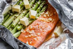 salmon and asparagus wrapped in aluminum foil