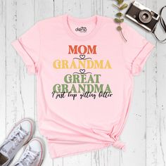 "Celebrate motherhood and grandmotherhood with this charming and stylish t-shirt! Featuring the phrase \"Mom Grandma Great Grandma I Just Keep Getting Better\" in a bold and eye-catching font, this shirt is perfect for any proud mom or grandma. Made from high-quality materials, this t-shirt is comfortable to wear and easy to care for. It's perfect for everyday wear, family gatherings, or as a thoughtful gift for a beloved mom or grandma in your life. You can find other sizes of this shirt in the links below. By clicking on the link, you can go to the blank shirt page and write the design you want in the personalization section when ordering.  Women V-Neck Shirt and Women Tank Sizes: https://etsy.me/3KB9RKo Our products are the Bella+Canvas brand. I will send another brand with the same qua Mother's Day Graphic Print Top For Family Reunion, Casual T-shirt For Mother's Day Family Gatherings, Mother's Day Family Reunion Graphic Print Tops, Relaxed Fit Tops With Lettering For Mother's Day, Graphic Tee Crew Neck Tops For Family Gatherings, Graphic Tee With Crew Neck For Family Gatherings, Pink Tops With Text Print For Mother's Day, Pink Relaxed Fit Tops For Mother's Day, Pink Tops With Funny Text For Mother's Day