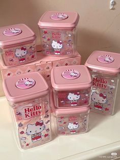 hello kitty storage containers are stacked on top of each other