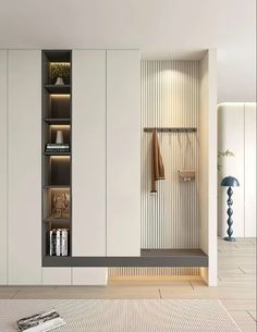 a room with white walls and shelves filled with books