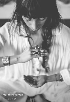 black and white photograph of a woman holding her hands together