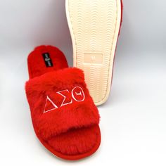 Experience ultimate comfort and style with our Simply Greek Plush Slide footwear! Designed with a slide-on style, open toe, and snug vamp, these slippers are both adorable and cozy. Crafted with a polyester upper and insole, they are the perfect choice for long hours of wear. Product Description: Color: Red Plush Off-white rubber bottoms (0.5 inch thick) SLIPPER SIZING CHART US Sizes Length Width Small 5 >> 6.5 24.3cm (9.5 inches) 10.1cm (3.98 inches) Medium 7 >> 8.5 25.7cm (10.1 inches) 10.4cm Comfortable Red Open Toe Slippers, Slides Slippers, Delta Sigma Theta, Long Hours, Sizing Chart, Womens Slippers, Open Toe, Slides, Slippers