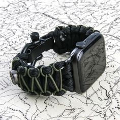 "➖ Handcraft Paracord 550 ➖ Designed for Apple Watch 42/44/45/49mm - Series 8/7/6/5/4/3/2/1/SE & Ultra ➖ Elite-Quality Shackle: Stainless Steel and Aluminum (No PEE) ➖ Quick and Easy Clip/Release ➖ Breathable and Waterproof Our band is made from premium quality 550 paracord and are designed to replace a stock Apple Watch band. This is a unisex watch accessory . Our designs are meant to be stylish and practical. Simple installation on the Apple Watch. Easy clip and quick release. SIZE (From 6 1/2 Black Bracelet Strap Apple Watch Band For Everyday, Wear-resistant Black Apple Watch Band For Outdoor, Black Wear-resistant Apple Watch Band For Outdoor, Adjustable Black Apple Watch Band For Outdoor, Wear-resistant Adjustable Apple Watch Band For Outdoor, Adjustable Wear-resistant Apple Watch Band For Outdoor, Black Paracord Watch Accessories For Outdoor, Outdoor Black Paracord Watch Accessories, Black Rectangular Watch Accessories For Outdoors