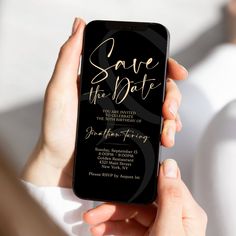 a woman holding up her phone with the text save the date on it in gold foil