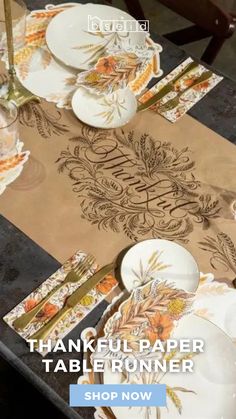 thanksgiving paper table runner with place settings on it and the words, happy thanksgiving written in large letters