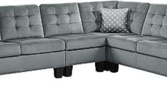 a gray sectional couch with two pillows on the back and one arm facing the other