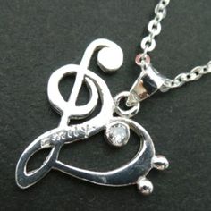 Discover Music Note Necklace.Base Material: Sterling Silver Size: 23mm (W) X 26 mm (H) (App Plus Hoop)Stone: Cz (Selectable)Chain Length: 16'' - 24'' InchesIf you need the item urgently, please contact us for Express Mail. There is an extra cost for Express service.You'll receive Order Shipped Email from us when your item is completed and shipped.**************************************SPECIAL ANNOUNCEMENT 1. Please visit https://www.etsy.com/shop/yhtanaff for more designs.2. Subscribe our newslet Silver Heart-shaped Music-themed Jewelry, Music-themed Silver Heart Jewelry, Treble Clef Necklace, Necklace Music, Music Note Necklace, Heart Music, Music Heart, Bass Clef, Discover Music