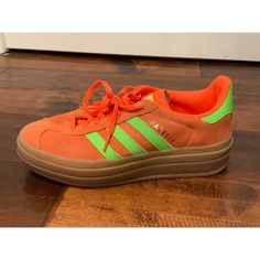 Women's Orange Sneakers By Adidas Originals The Gazelle H06126 Us Size: 6 Eu Size: 37.5 * Collegiate Orange Suede Body; Neon Green Leather Panels * Layered Tan Rubber Soles * Lace Up Condition: In Great Condition. Minimal Wear At Body And Soles. See Photos For Additional Details. Please Let Me Know If You Have Any Additional Questions And Feel Free To Check Out My Other Listings. Thanks! 43803 Adidas Low-top Platform Sneakers With Rubber Sole, Low-top Adidas Platform Sneakers, Adidas Lace-up Platform Sneakers With Gum Sole, Sporty Adidas Platform Sneakers With Round Toe, Adidas Low-top Platform Sneakers With Laces, Adidas Lace-up Platform Sports Sneakers, Adidas Athleisure Sneakers With Round Toe, Adidas Casual Platform Sneakers With Laces, Adidas Platform Sneakers With Gum Sole