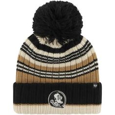 a black and white striped hat with a pom