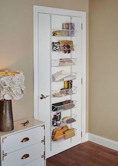 the door is open to reveal an organized pantry