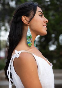 Description No matter where you go, bring a slice of island life with you in the form of our Paradisio beaded earrings! These tropically-inspired pieces are bright, fun, and chill - perfect for lifting up your mood in the office, or for when you want a reminder that there are always good times around the corner. Handmade with meticulous fringe beadwork, they're your passport to tropical bliss. Elevate your style and keep the festive spirit rolling wherever you wander! 🏝 Specifications Size: 11. Unique Beaded Drop Earrings For Beach, Unique Handmade Earrings For Vacation, Single Drop Earring For Vacation, Beaded Dangle Beach Jewelry, Multicolor Dangling Beads Jewelry For Vacation, Beach Earrings With Dangling Beads, Beaded Dangle Jewelry For Beach, Beaded Dangle Jewelry For The Beach, Summer Beach Drop Earrings