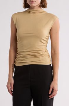 This sleeveless top in an easy, relaxed fit is an excellent addition to your chill-time wardrobe. Mock neck Sleeveless 95% rayon, 5% polyester Dry clean Imported Versatile Solid Sleeveless Blouse, Calvin Klein Stretch Tank Top, Calvin Klein Solid Tops For Summer, Calvin Klein Summer Tops, Chic Stretch Tops By Calvin Klein, Spring Stretch Calvin Klein Tops, Versatile Sleeveless Fitted Blouse, Versatile Fitted Sleeveless Blouse, Calvin Klein Stretch Tops For Spring