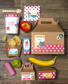 an apple, banana, yogurt and other food items are laid out on a wooden table