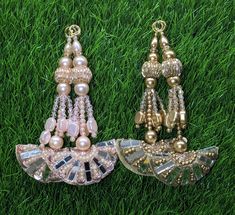 Indian Handmade Beaded Latkan Tassels for Saree blouse HandBags Hangings Dupatta Bridal Wedding dress for Women pair of 2 pcs Size - 11 cm Length  Item Description You can use this Beautiful pair of tassle for several DIY projects.  *These beautiful Tassel Latkans are used as the accessory for Lahenga and saree , but u can use according to your need and your innovative ideas. * Package contains 2 Latkan / 1 Pair you can use these latkans in various ways Craft Projects Designing Home Decoration Festive celebrations. Evening and party Apparels. Home décor items Apparel & Fashion Scarves n Stoles Headband, hats Table cover, curtains, Pillow covers, Cushion cover Shoe designing Headband, hats Table cover, curtains Designing stylish blouses Ship From New Delhi, India 2 Latkan / 1 Pair Tassels For Saree, Latkan Tassels, Dupatta Bridal, Wedding Dress For Women, Stylish Blouses, Designing Home, Bridal Wedding Dress, Fashion Scarves, Innovative Ideas