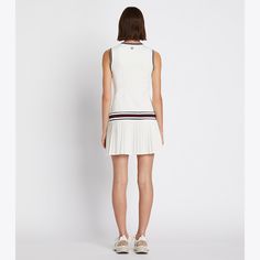 Inspired by the elegance of sport, our Performance V-Neck Tennis Dress is a play on iconic Seventies sportswear. Made from performance jersey with a silky-soft feel, it is breathable, moisture wicking and has great stretch and recovery. On the court, pair it with our Seamless Short. White Tennis Dress With Built-in Shorts, Sporty Go-dry Tennis Dress, Sports Tennis Dress With Built-in Shorts, Mini Tennis Dress With Built-in Shorts, Sporty V-neck Tennis Dress, Tennis Wear, Tennis Shorts, Tennis Dress, Tennis Skirt