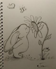 a pencil drawing of a bunny smelling a flower